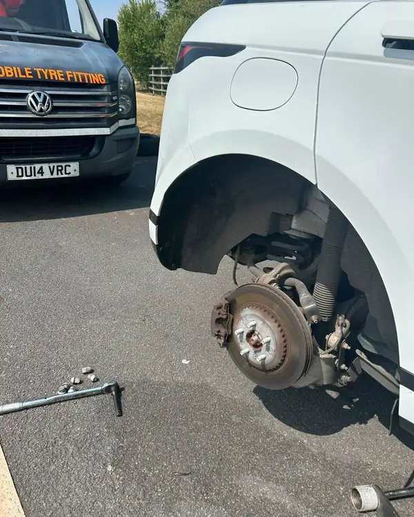 SUV wheel off for a tyre replacement at the roadside